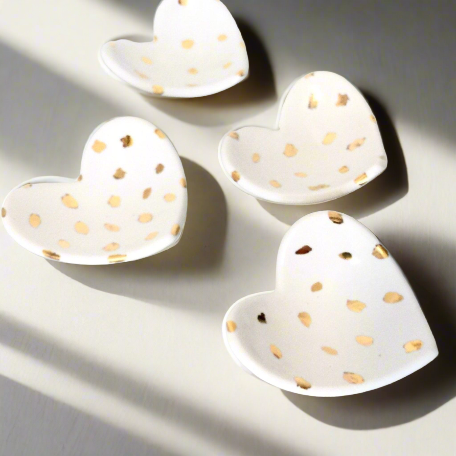 Muddy Heart handmade ceramic heart dishes with gold accents