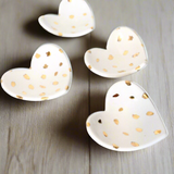 Handcrafted heart-shaped ceramic dishes with 22k gold polka dots