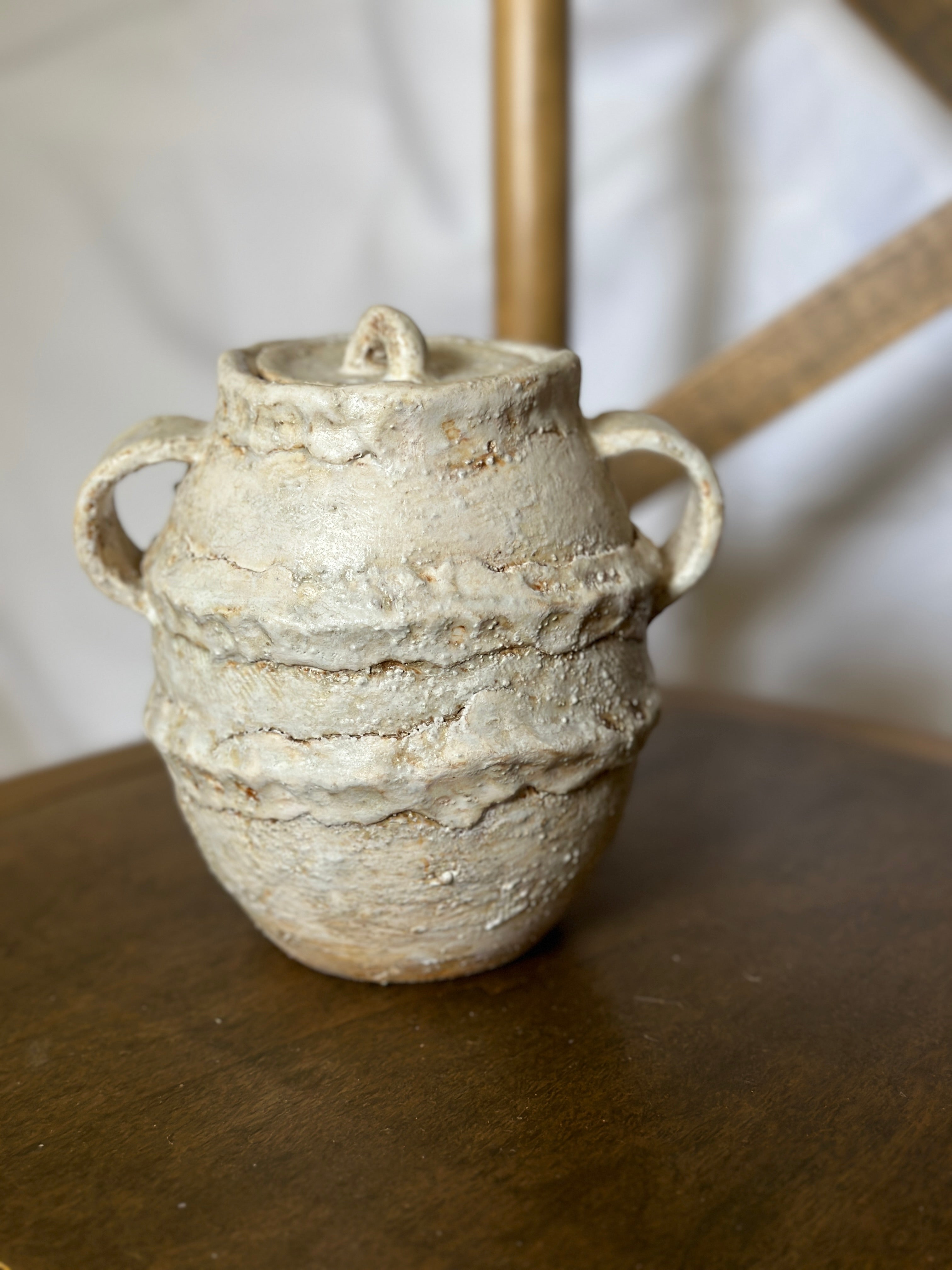 Handmade ceramic jar with lid in textured white glaze