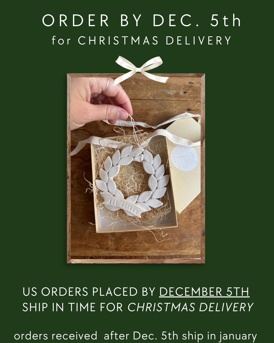 The image is a promotional poster for Christmas delivery orders. It features a hand placing a white ornament into a wooden box, which is placed on a wooden surface. The text on the poster indicates that orders are placed by December 5th and that the ship will be in time for Christmas delivery. The text also mentions that orders received after December 5th will be shipped in January.