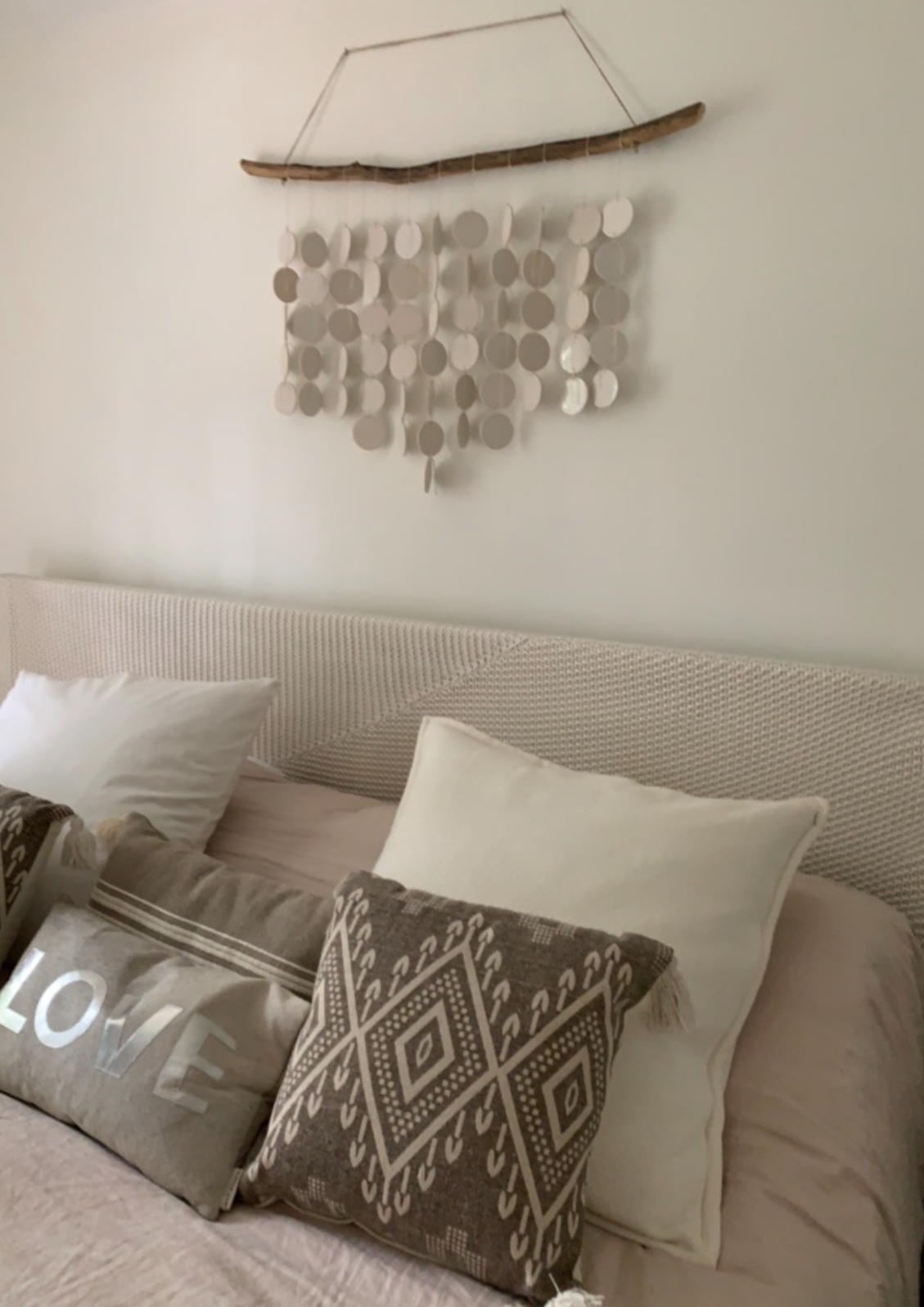 Stylish coastal home decor with hanging ceramic discs