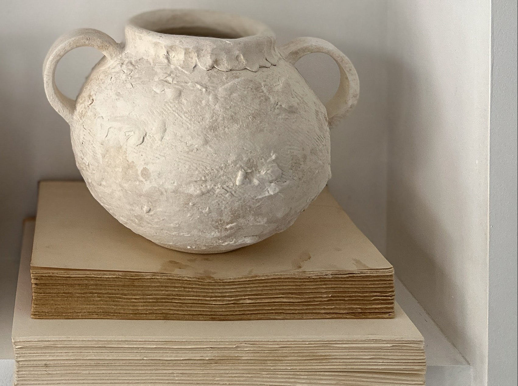Handmade wide banded stoneware vessel with a raw clay exterior