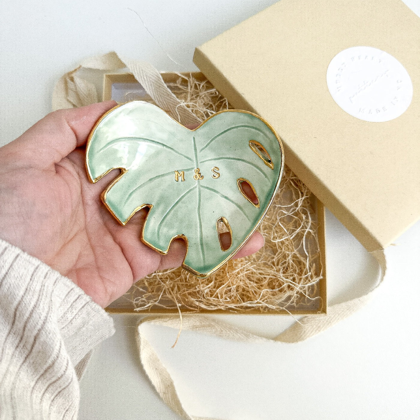 Unique green monstera leaf ceramic dish with personalized gold initials, perfect for boho home decor