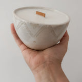 Stylish hand-poured soy candle with vanilla scent and ceramic bowl