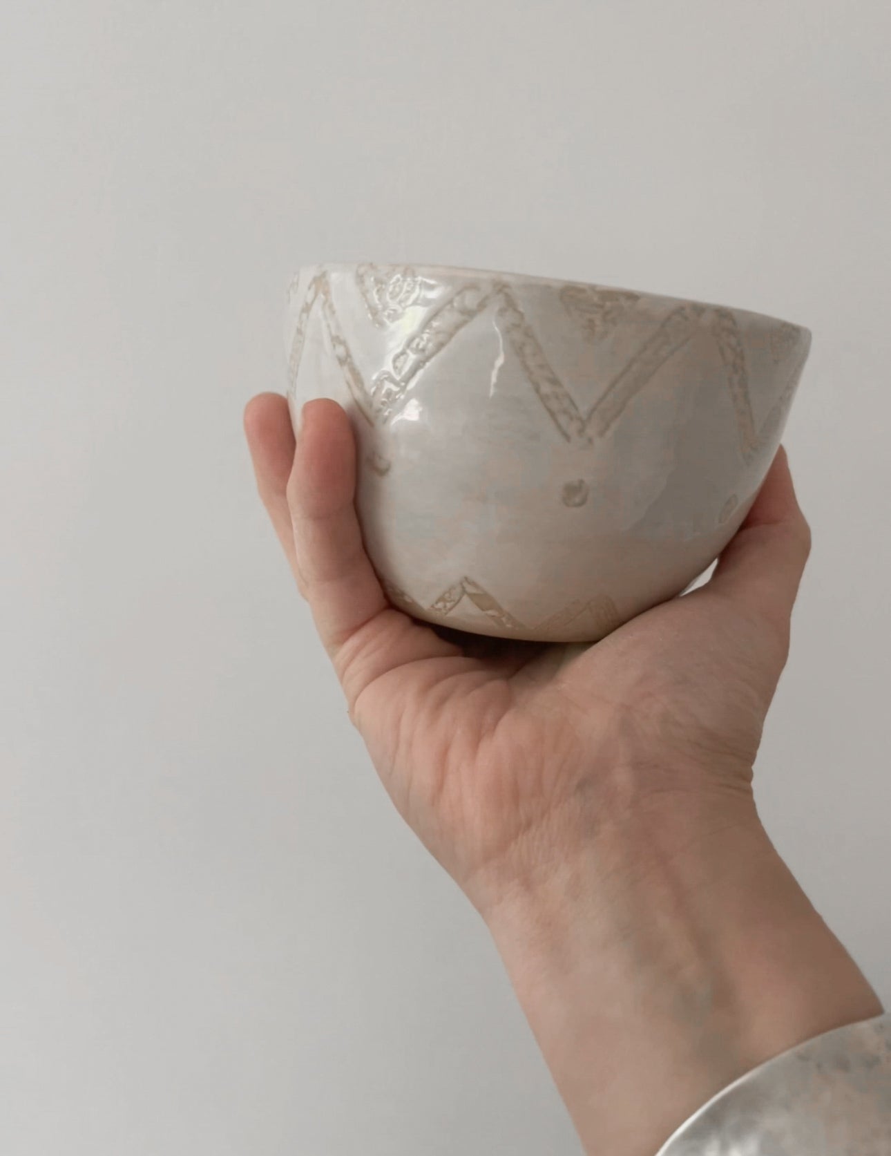 Stylish hand-poured vanilla soy candle in an artisanal ceramic bowl