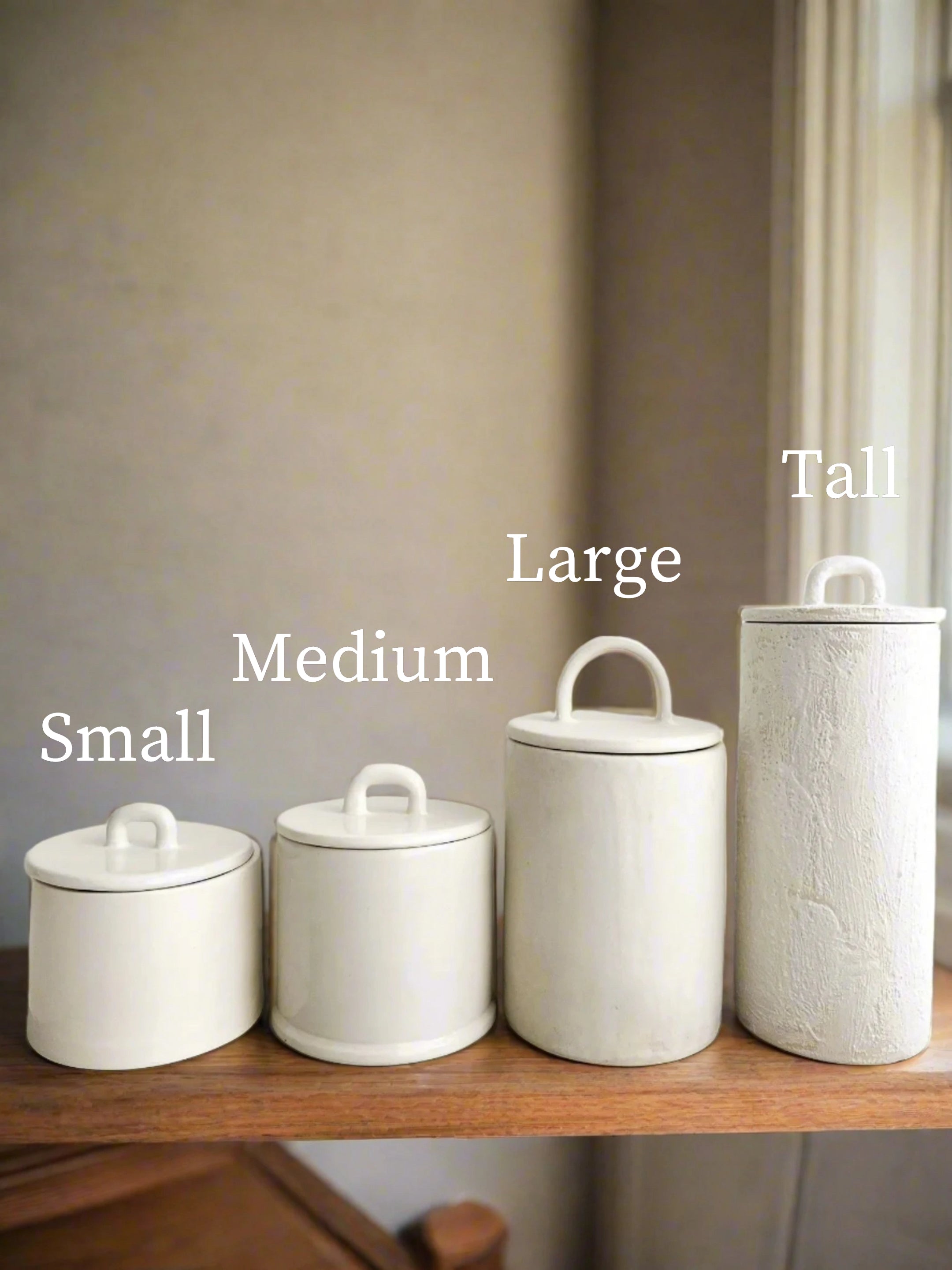 Staggered ceramic canisters set in custom colors and sizes