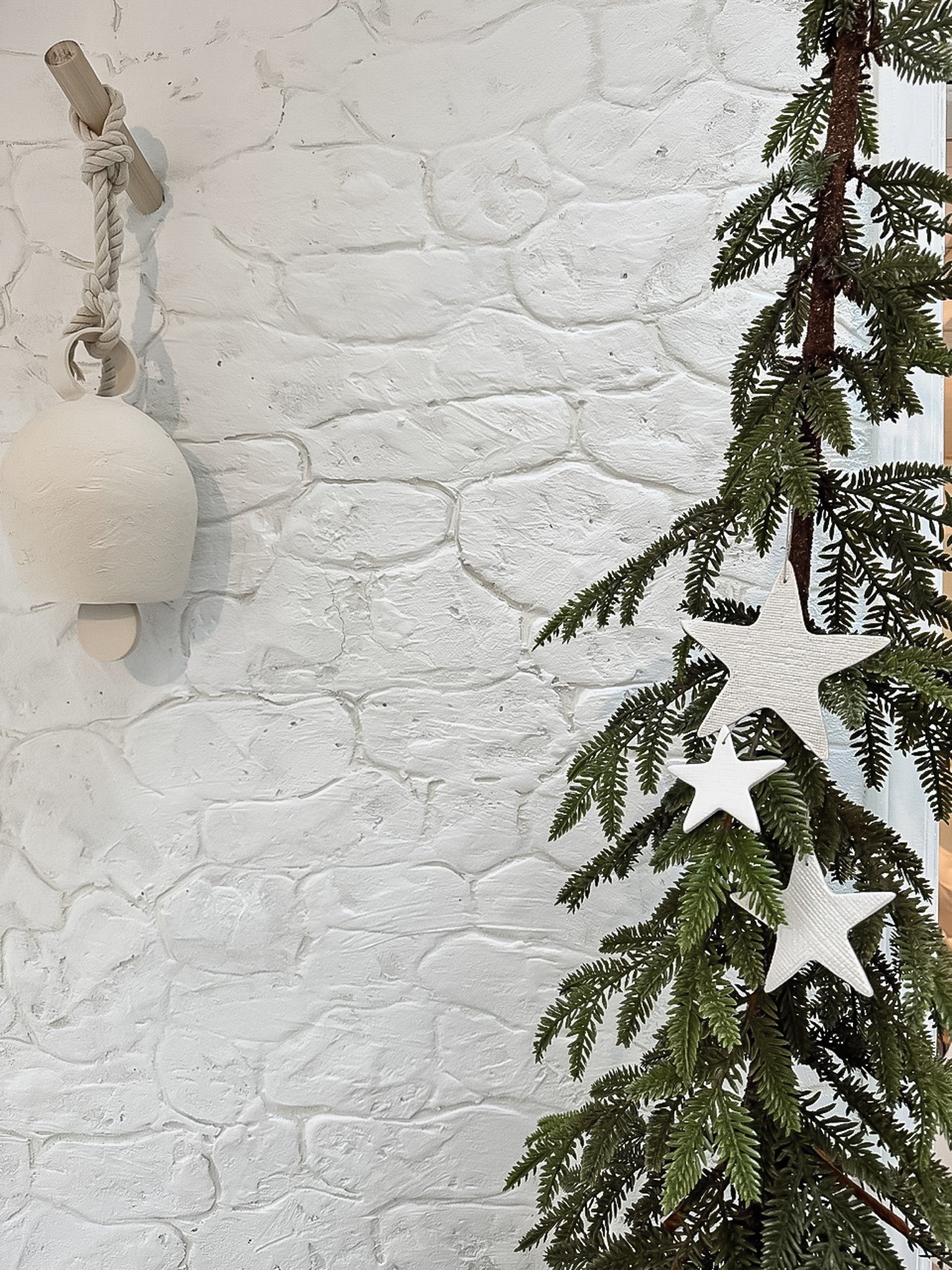 Timeless white ceramic star ornaments, lovingly handmade with unique textures, perfect for chic holiday decor